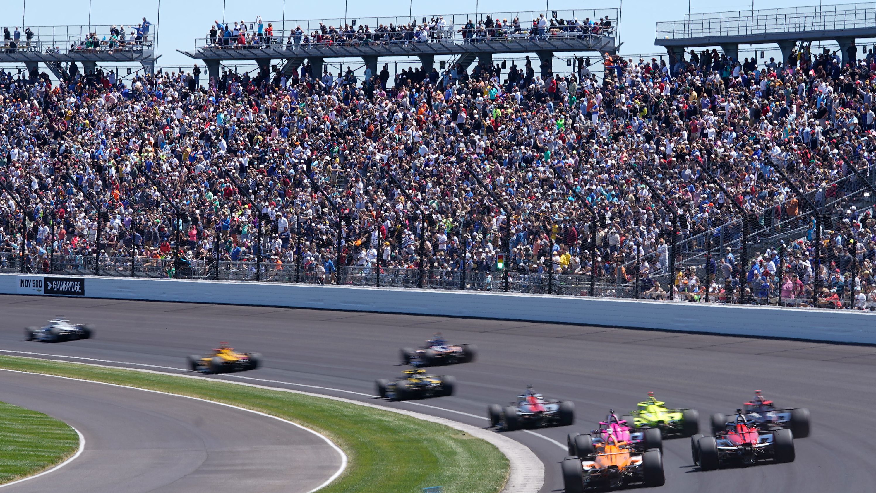 Fans watch the Indianapolis 500 auto race on Sunday. This year's event was billed as the most-attended sporting event since the pandemic's start, with the 135,000 available tickets quickly selling out.