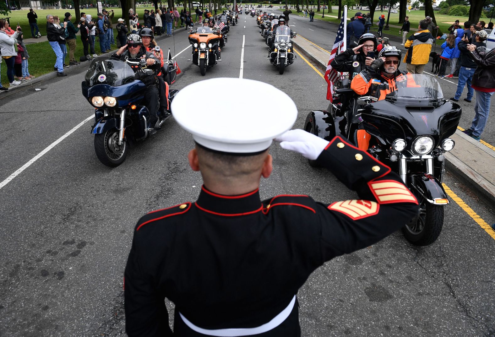 Veteran Tim Chambers salutes motorcyclists participating in the "Rolling to Remember" event in Washington, DC, on Sunday, May 30.