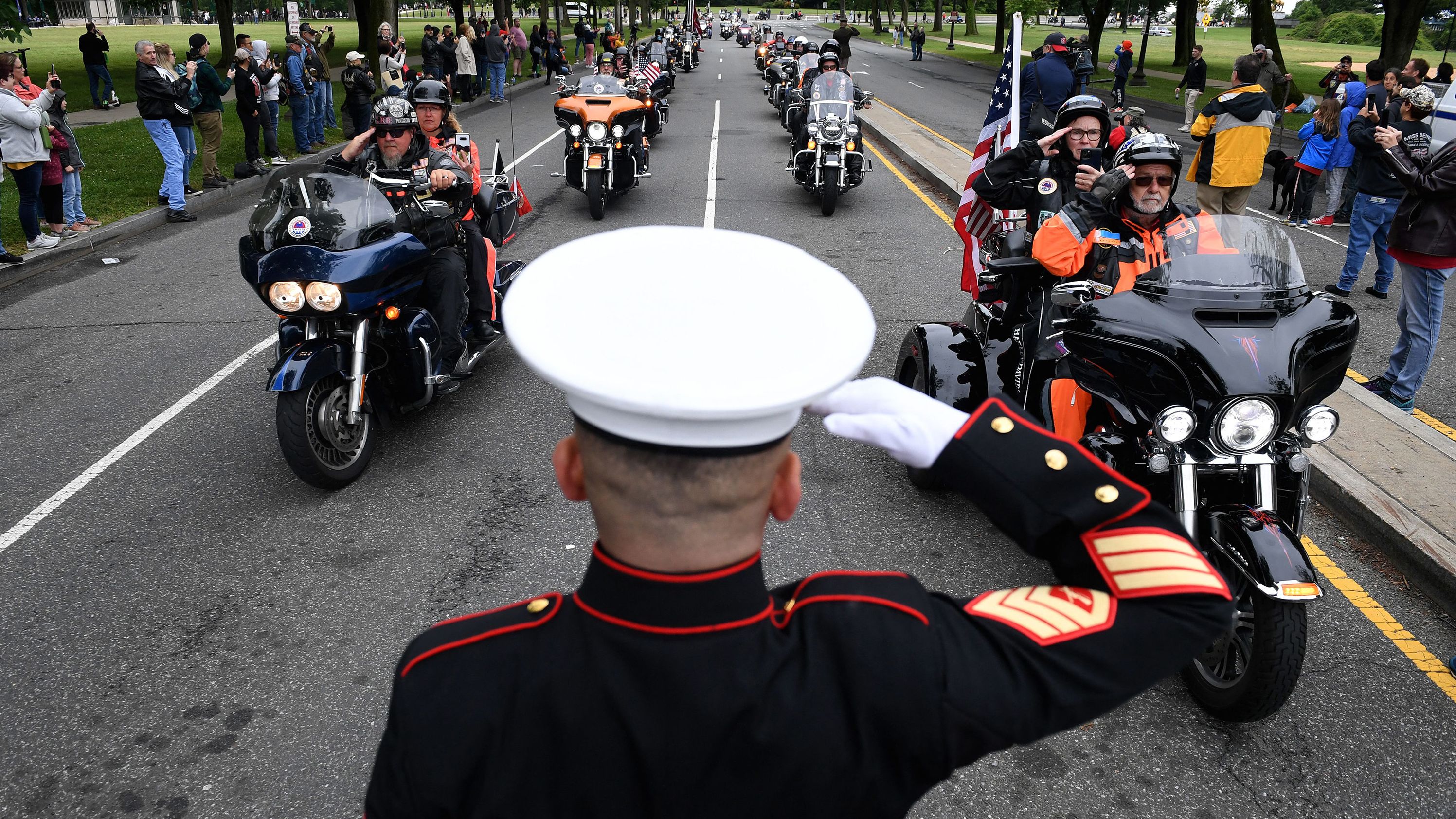 Veteran Tim Chambers salutes motorcyclists participating in the "Rolling to Remember" event in Washington, DC, on Sunday, May 30.