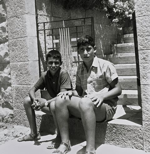 A 17-year-old Netanyahu, right, sits with a friend at the entrance to his family home in Jerusalem in 1967. Netanyahu spent his teenage years in the United States, going to high school in Philadelphia.