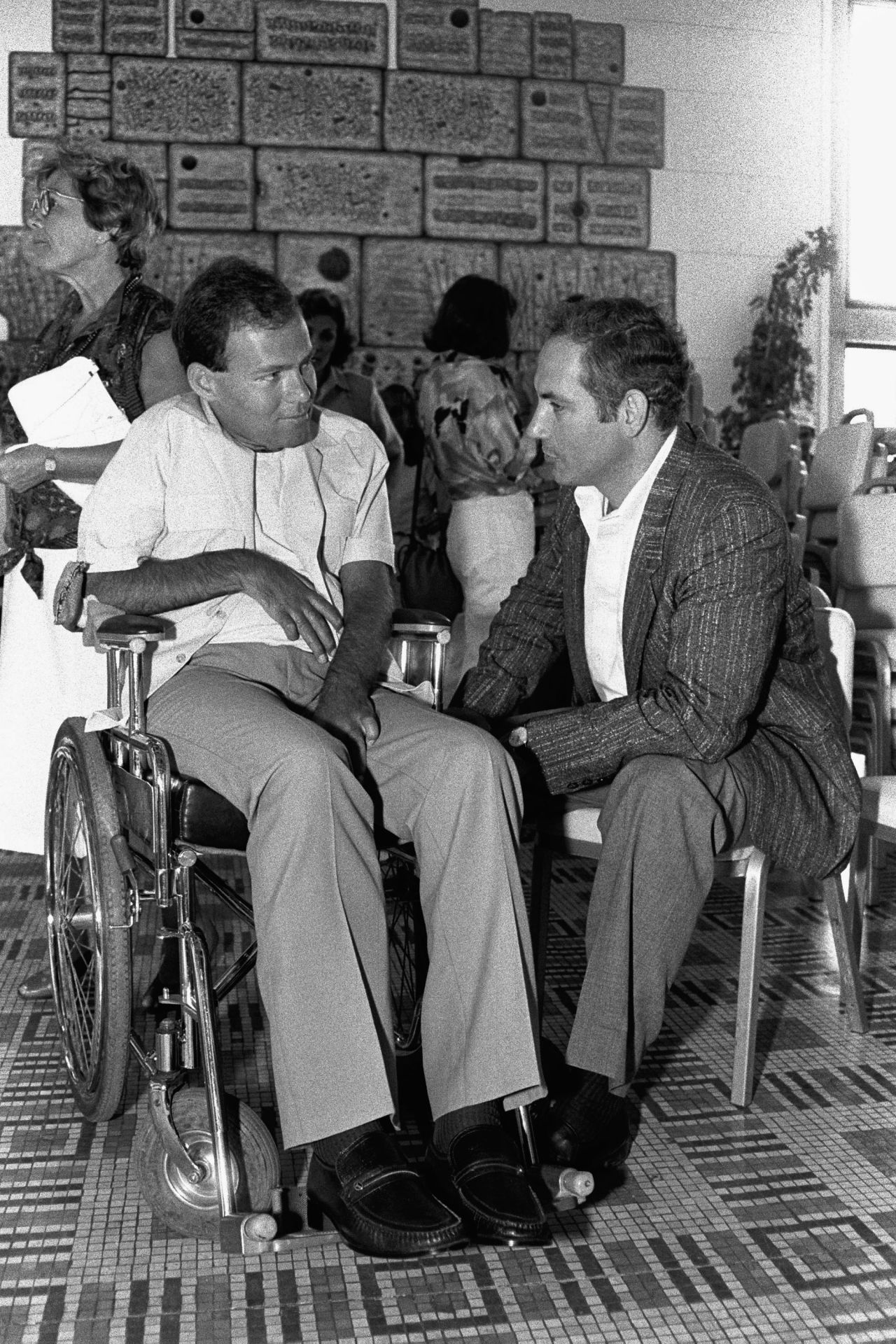 In 1986, Netanyahu speaks with Sorin Hershko, one of the Israeli soldiers wounded in Operation Entebbe. It was the 10th anniversary of Operation Entebbe, a dramatic rescue of Jewish hostages at Uganda's Entebbe Airport. Netanyahu's brother, Yonatan, was killed leading Operation Entebbe in 1976. Affected by his brother's death, Netanyahu organized two international conferences on ways to combat terrorism — one in 1979 and another in 1984.