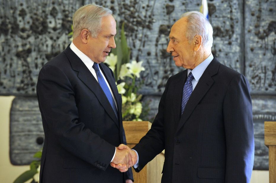 Netanyahu shakes hands with Israeli President Shimon Peres in February 2009 after winning backing from the Israeli parliament to become prime minister again. A close election between Netanyahu and rival Tzipi Livni had left the results unclear until the parliament's decision.