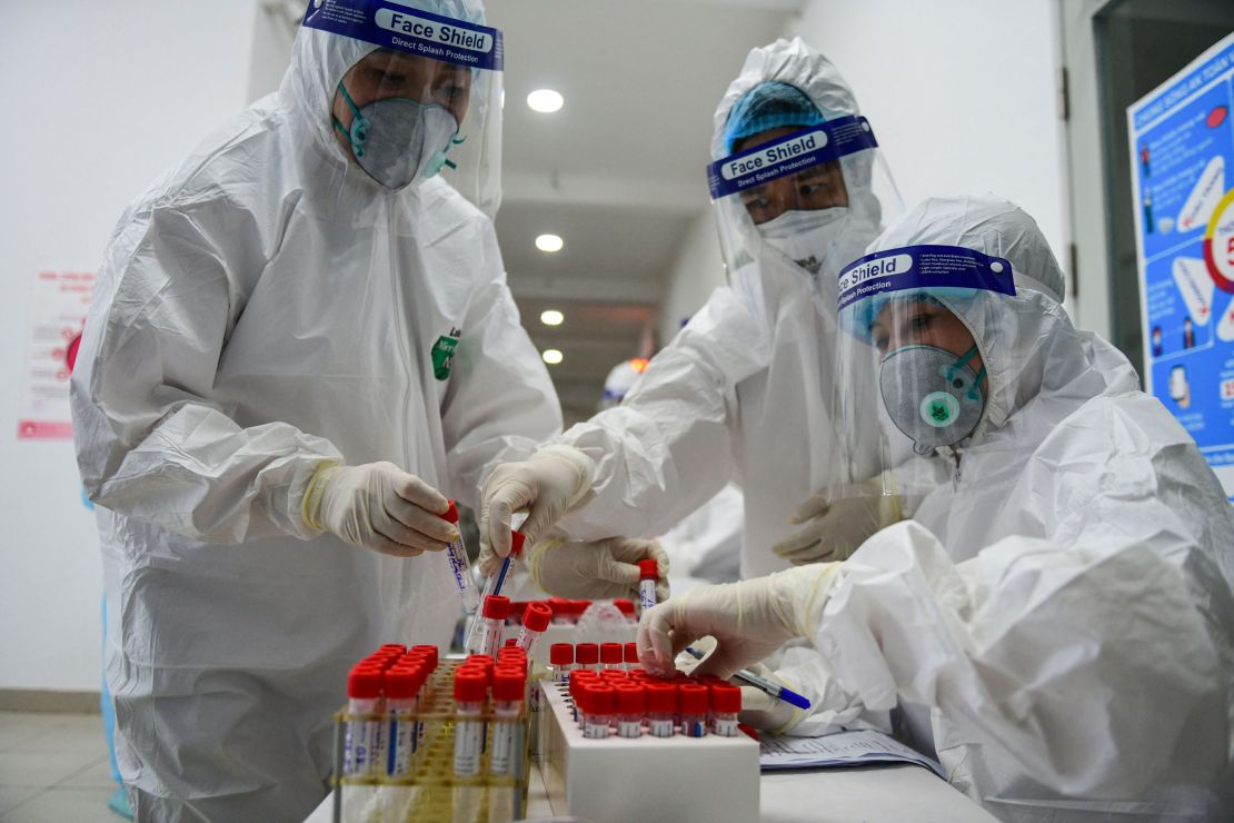 Health workers collect swab samples to test for Covid-19 at the Thanh Xuan district medical centre in Hanoi on May 15.