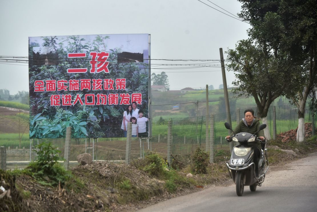 A signboard promoting China's two-child policy in Neijiang, China, on March 23, 2017. 