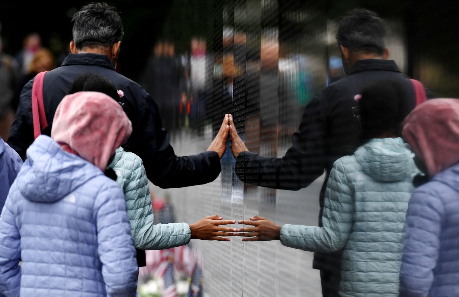 People visit the Vietnam Veterans Memorial in Washington, DC, on Sunday.