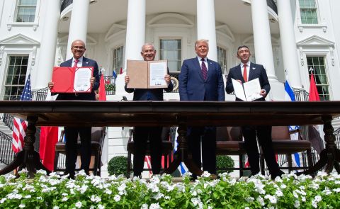 From left, Bahrain Foreign Minister Abdullatif al-Zayani, Netanyahu, US President Donald Trump and United Arab Emirates Foreign Minister Abdullah bin Zayed Al-Nahyan hold up documents at the White House after participating in the signing of the Abraham Accords in September 2020. The agreement normalized relations between Israel and the two Gulf nations.