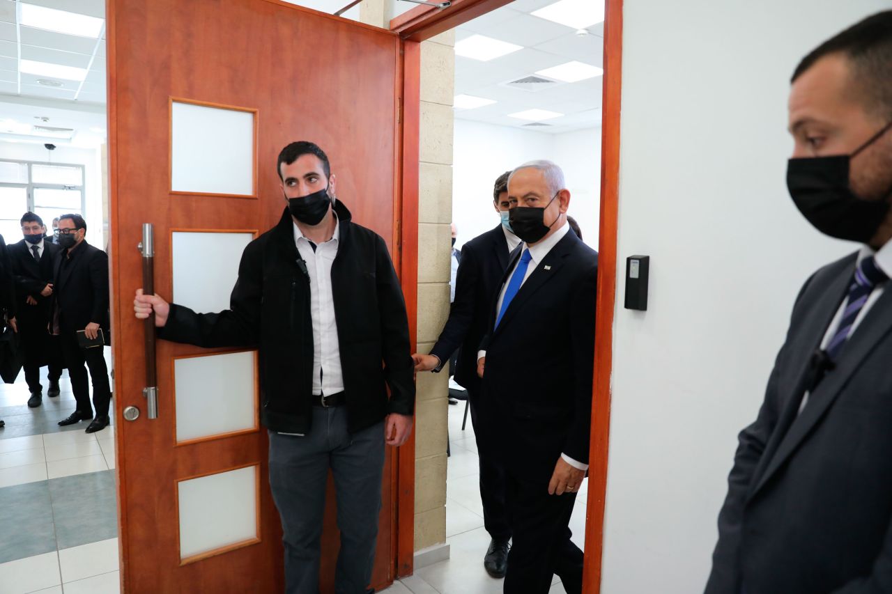 Netanyahu comes out of a Jerusalem courtroom during the evidence-hearing stage of his corruption trial in April 2021. Netanyahu faces charges in three separate cases. He has denied the charges, describing them as a media-fueled witch hunt against him.