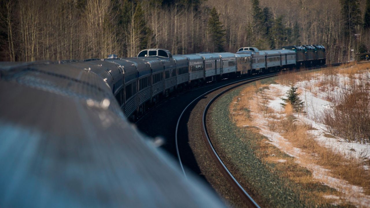 A Via Rail passenger train travels through Canada's Rocky Mountains.