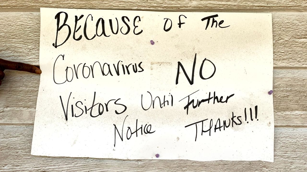 A sign warns visitors away from a home in rural Cuthbert, Georgia, an area hit hard by the pandemic.
