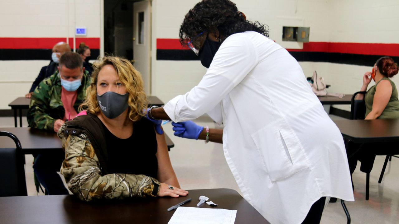 Nurse Joyce Barlow, right, gives the Covid-19 vaccine to a resident in Cuthbert, Georgia, at a vaccine clinic organized by local volunteers.