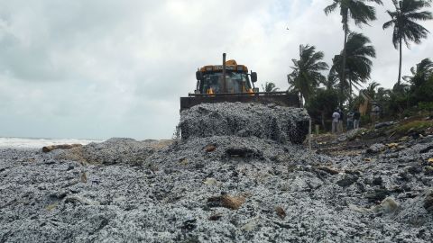 An earthmover removes debris from the X-Press Pearl ship, on a beach at Pamunugama in Negombo, Sri Lanka, on May 28.