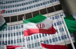The flag of Iran is seen in front of the building of the International Atomic Energy Agency (IAEA) Headquarters on May 24, 2021 in Vienna, Austria. 