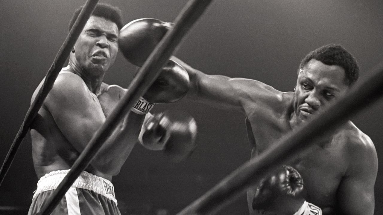 Muhammad Ali takes a hit from Joe Frazier during their heavyweight match which was coined 'The Fight of the Century.'