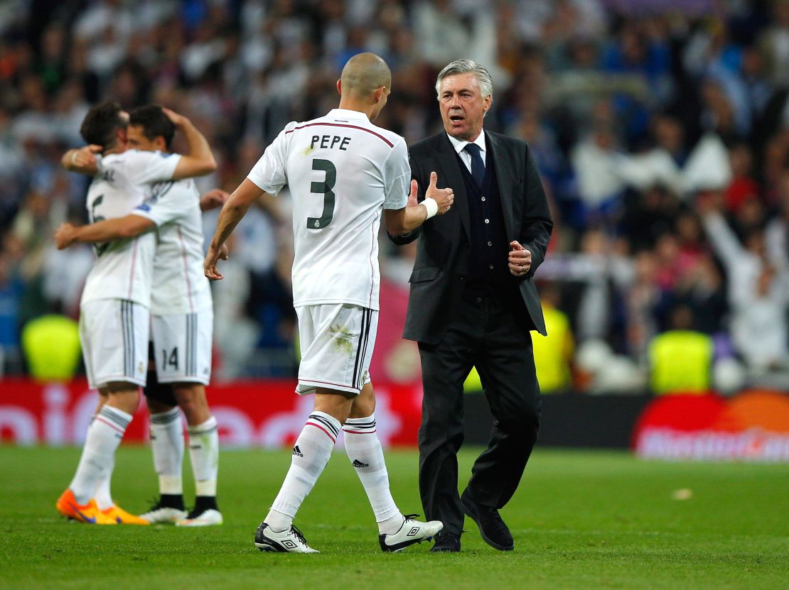 Pepe celebrates victory with Ancelotti after the UEFA Champions League quarter-final second leg match against Atletico Madrid.  