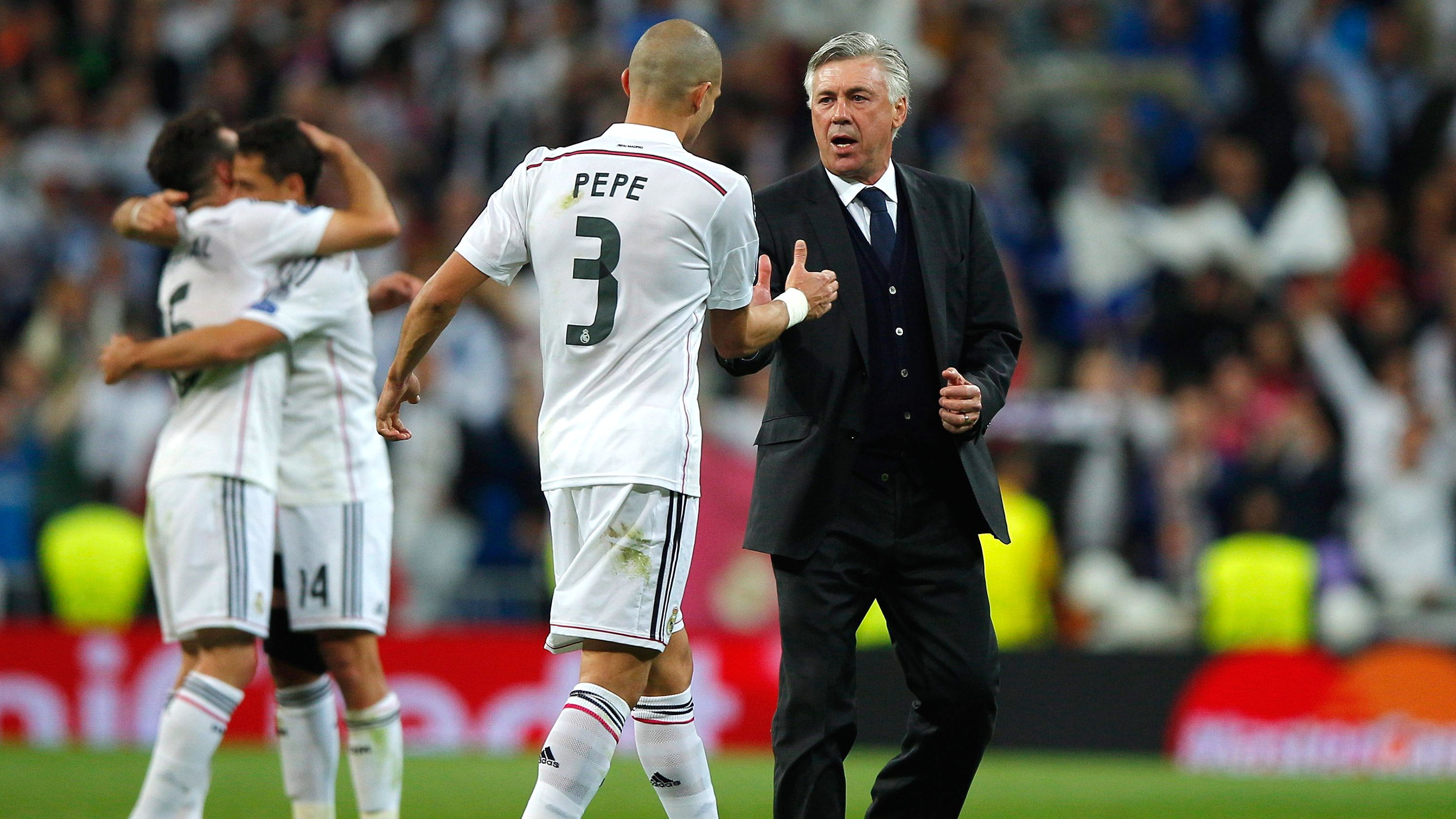 Pepe celebrates victory with Ancelotti after the UEFA Champions League quarter-final second leg match against Atletico Madrid.  