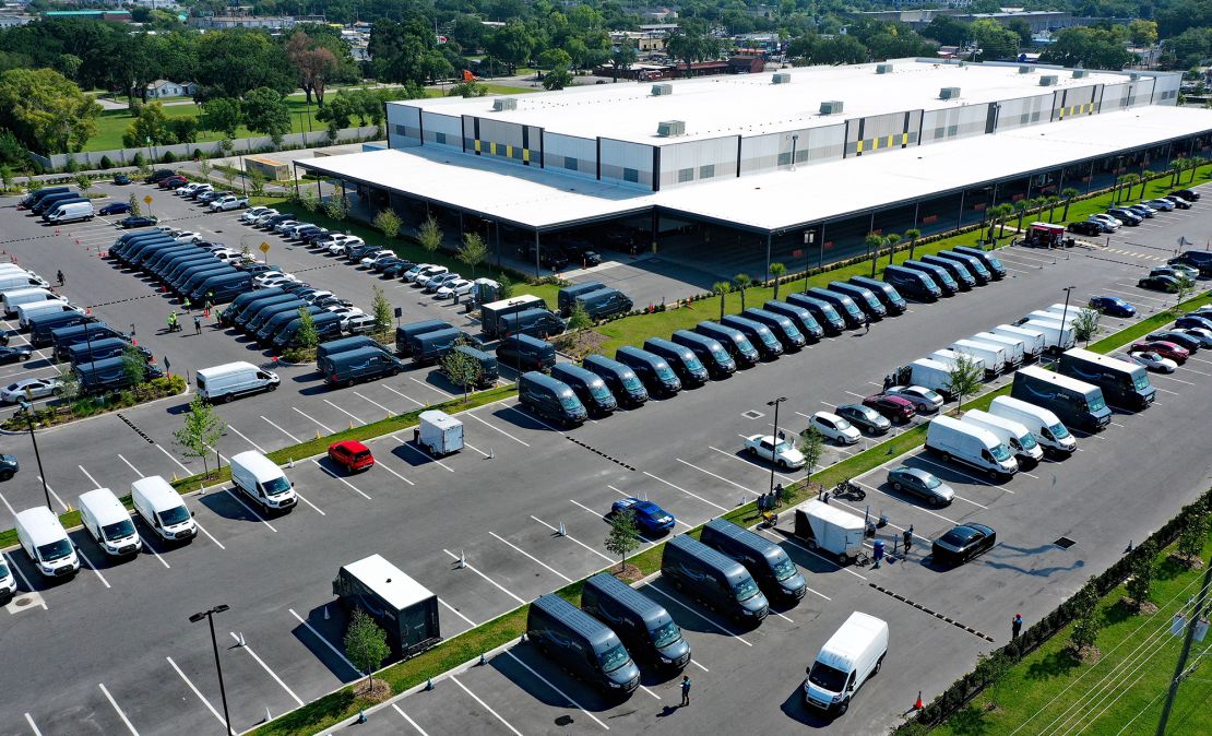 In this aerial view from a drone, delivery vans are seen parked at an Amazon last-mile delivery facility on May 1, 2021 in Orlando, Florida. Amazon announced that it will hold it annual two-day Prime Day shopping event in its second quarter, rather than July, to boost spending in what is typically a slower time for retail sales.