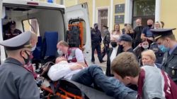 A still image taken from video footage shows Belarusian prisoner Stepan Latypov, who was arrested during a security crackdown on mass protests following a contested presidential election in 2020, being carried out of a court building after a suicide attempt in Minsk, Belarus June 1, 2021. Radio Free Europe/Radio Liberty (RFE/RL)/Handout via REUTERS TV   ATTENTION EDITORS - THIS IMAGE HAS BEEN SUPPLIED BY A THIRD PARTY. NO RESALES. NO ARCHIVES. MANDATORY CREDIT RADIO FREE EUROPE/RADIO LIBERTY.