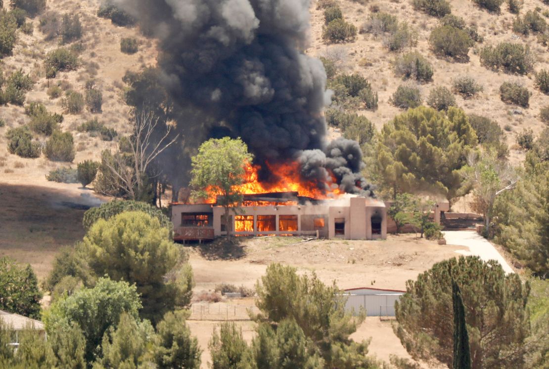 A home burns in the 2600 block of W. Bent Spur Drive in Acton, California, on Tuesday, June 1, 2021. 