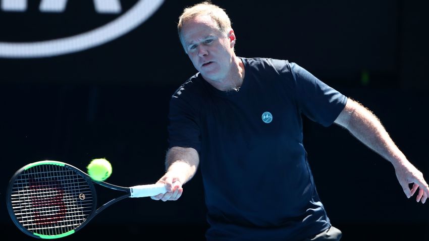 MELBOURNE, AUSTRALIA - JANUARY 21:  Patrick McEnroe of the United States plays a forehand in his Men's Legends match with and John McEnroe of the United States against Henri Leconte of France and Todd Woodbridge of Australia during day eight of the 2019 Australian Open at Melbourne Park on January 21, 2019 in Melbourne, Australia.  (Photo by Scott Barbour/Getty Images)