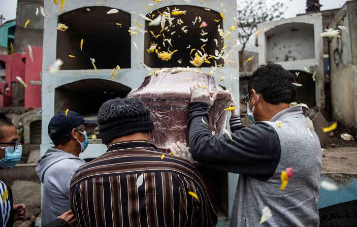 A Covid-19 victim is laid to rest in a graveyard in Comas, Peru, on June 1. Peru has <a href="index.php?page=&url=https%3A%2F%2Fwww.cnn.com%2F2021%2F06%2F01%2Famericas%2Fperu-covid-death-toll-intl%2Findex.html" target="_blank">more than doubled</a> its official death toll from the Covid-19 pandemic following a government review of the figures. That leaves the country with the world's highest coronavirus-related death rate per capita.