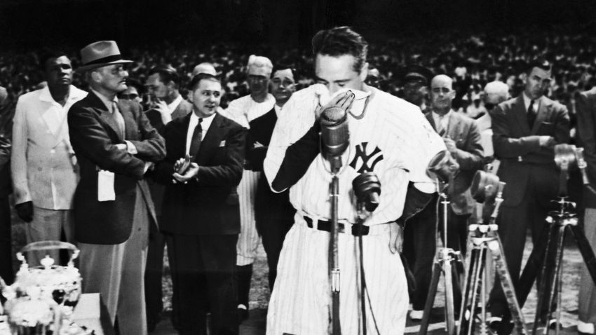 (Original Caption) 7/4/39-New York: Lou Gehrig, the "Iron Horse" of baseball, who was forced to the bench by ALS after playing 2,130 consecutive games, is touched by fans demonstration as he is acclaimed in a manner unrivaled in baseball history. Upwards of 75,000 jammed Yankee Stadium to honor Lou. He is shown here--handkerchief to his face, deeply moved by the ovation they gave him.