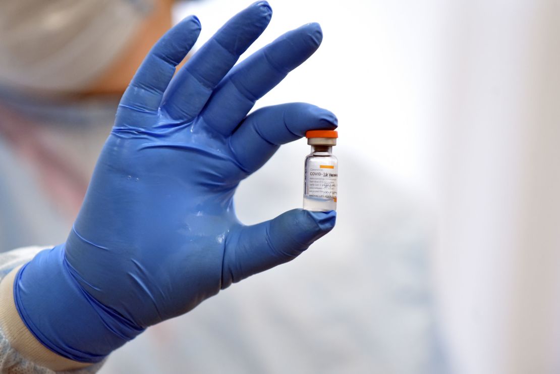 A health care worker holds a vial with the CoronaVac vaccine during the vaccination campaign in Kyiv, capital of Ukraine.
