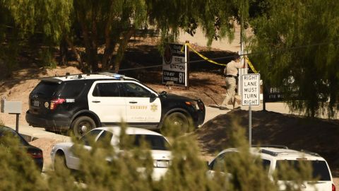 A Los Angeles County Sheriff Department vehicle parks outside the scene of Tuesday's shooting at a fire station in Agua Dulce, California.