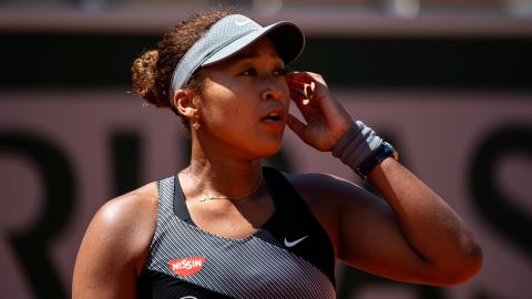 Osaka looks to her team during her match against Patricia Maria Țig at Roland Garros.