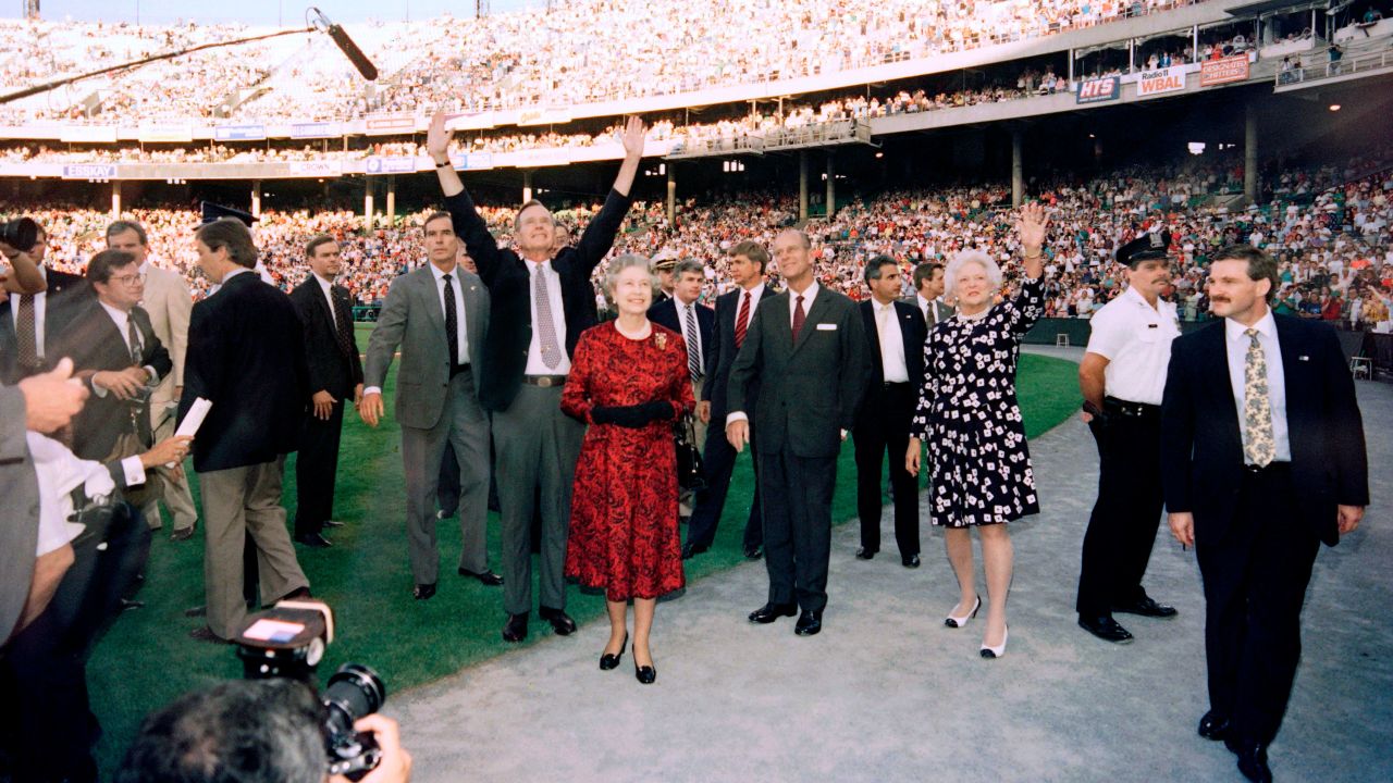 US President George Bush (C), Britain's Queen Elizabeth II (C), Prince Philip, Duke of Edinburgh (4th R) and Barbara Bush (3rd R) wave to the crowd before the start of the Orioles vs. the Oakland Athletics baseball game at the Memorial Stadium in Baltimore on May 15, 1991. 