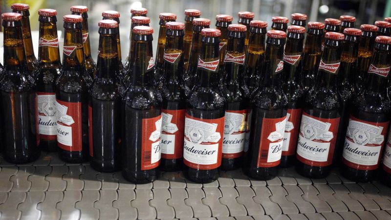 NextImg:Anheuser-Busch to lay off employees after Bud Light loses spot as top-selling beer to Modelo in May | CNN Business