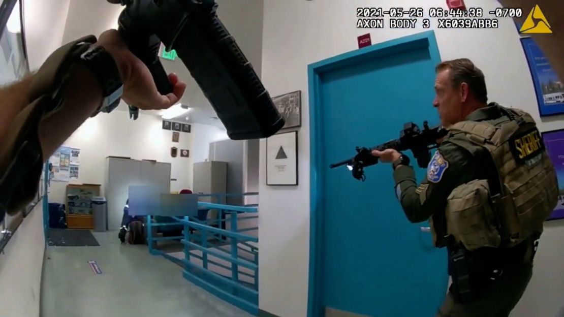 Body-camera footage shows law enforcement officers approach gunman Samuel Cassidy's body shortly after, authorities say, he shot himself after killing nine colleagues.
