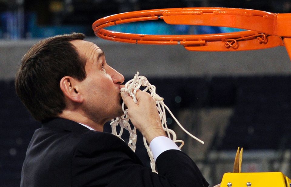 Krzyzewski kisses the net following Duke's 2010 title.