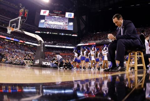 Krzyzewski sits courtside during the 2015 national title game against Wisconsin. The Blue Devils went on to win their fifth championship.