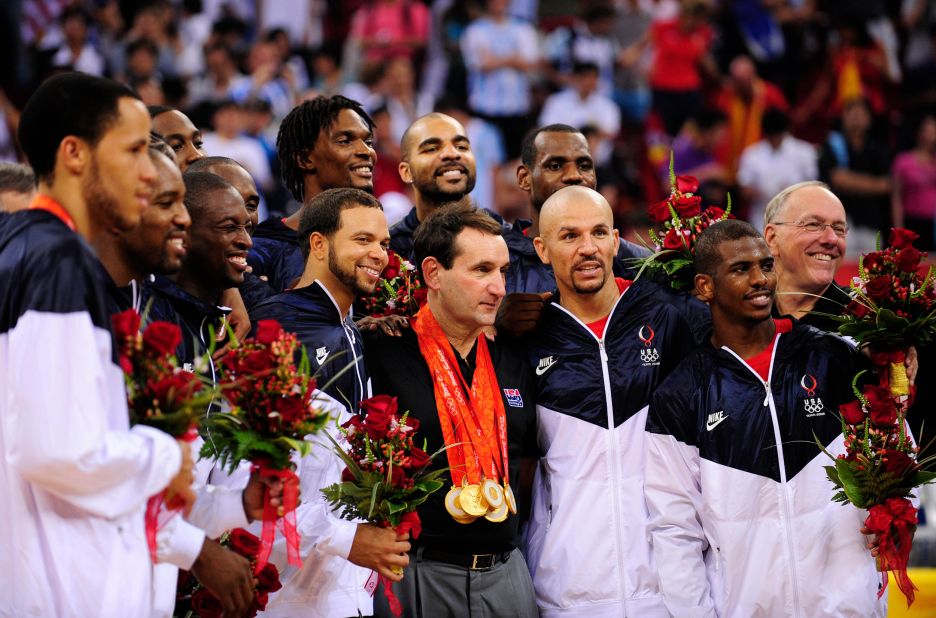 Krzyzewski wears numerous gold medals while celebrating the Olympic win with his team in 2008.