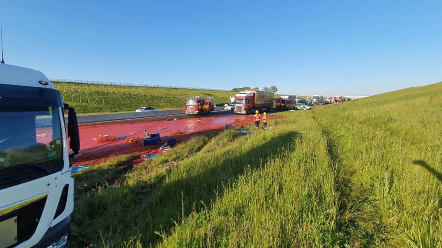 A truck carrying tomato puree crashed in England on Tuesday, spilling its contents and turning the road red.