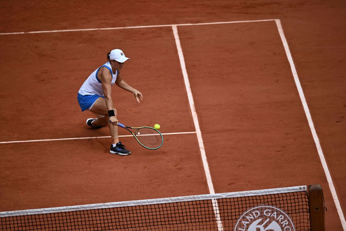 Barty returns the ball to Linette during their women's singles second round match.