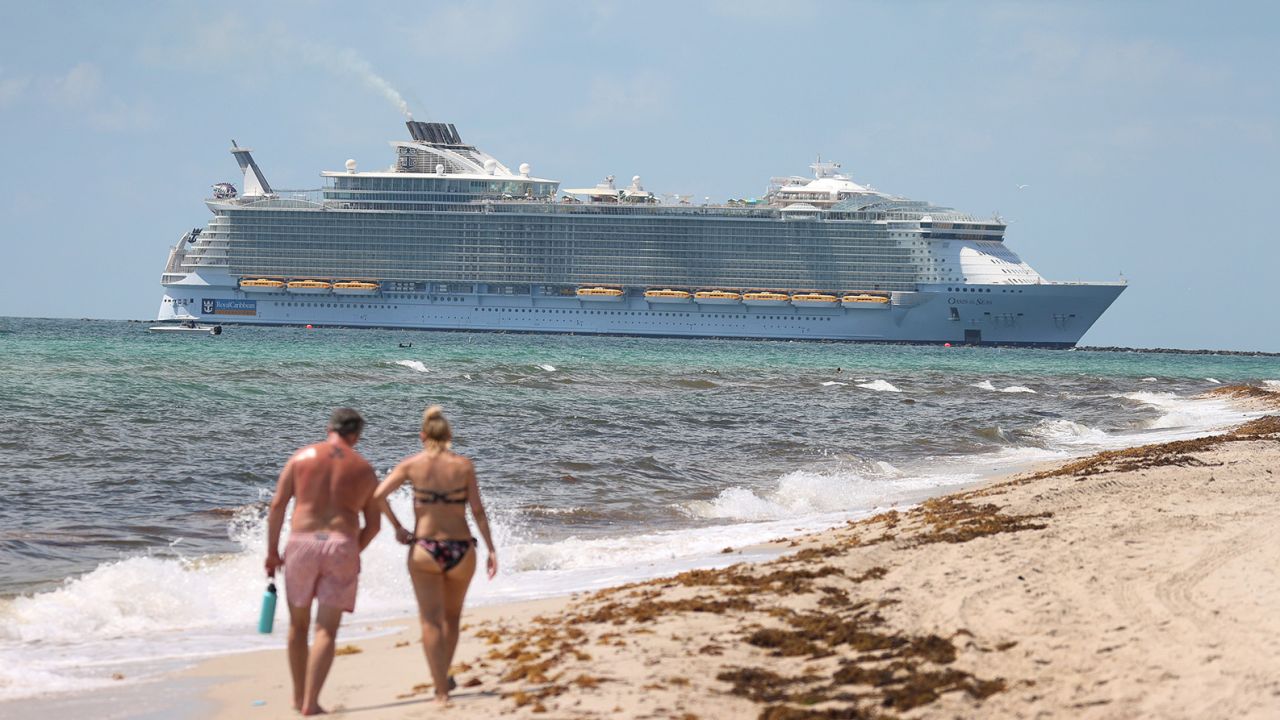 MIAMI BEACH, FLORIDA - MAY 28:  The Royal Caribbean Oasis of the Seas cruise ship sails past as it prepares to dock at PortMiami on May 28, 2021 in Miami Beach, Florida. The Centers for Disease Control said it has given approval for one cruise ship from Royal Caribbean to resume sailing in June. The ruling comes more than a year after U.S. cruising was suspended because of the COVID-19 pandemic. (Photo by Joe Raedle/Getty Images)