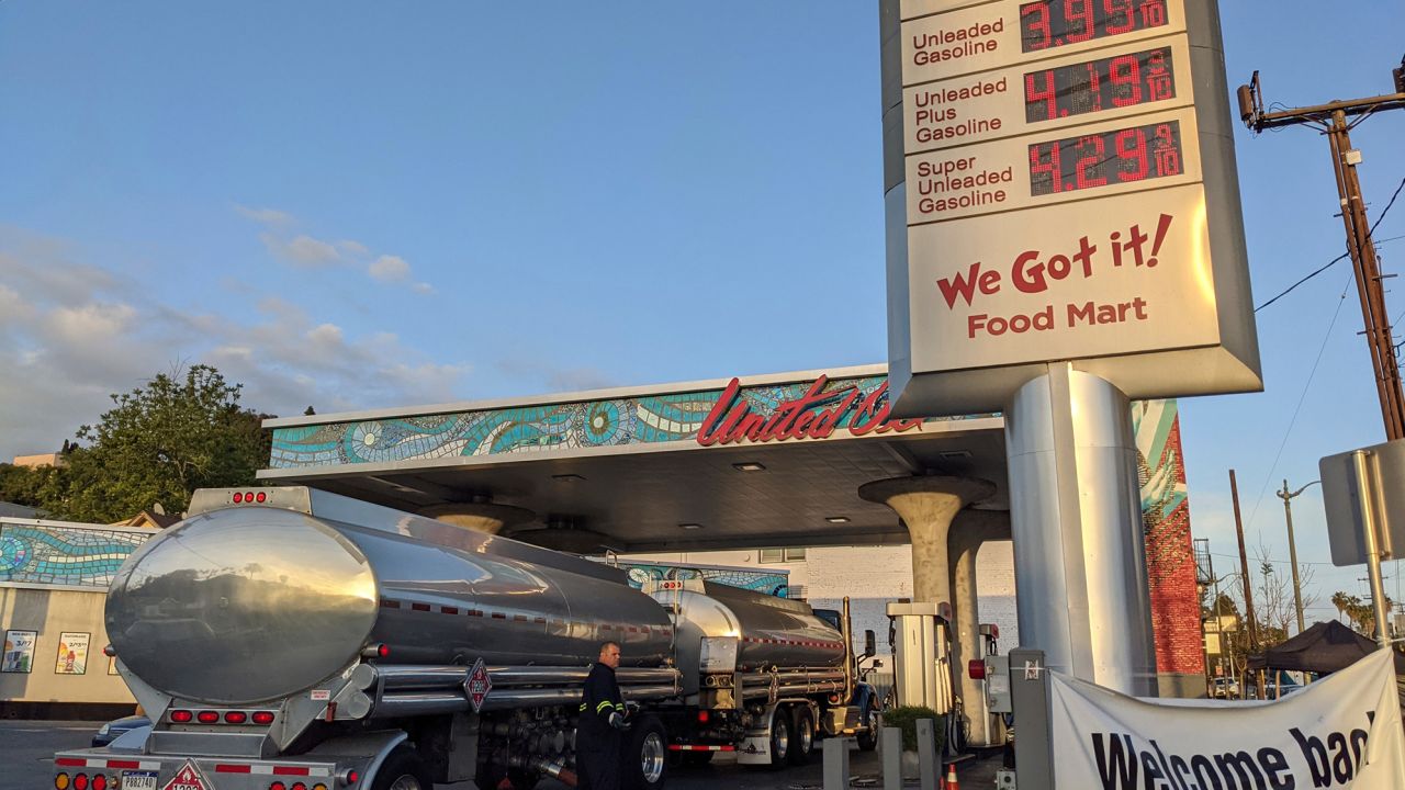 A truck driver checks the gasoline tank level at a United Oil gas station in Sunset Blvd., Los Angeles on May 20.