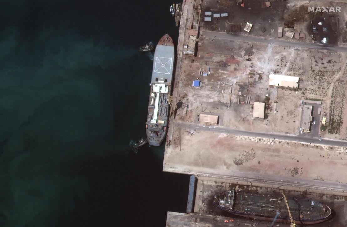 The Iranian ship Makran is seen in this Maxar Technologies satellite image from early May in Persian Gulf around Larak Island.  The boat appears to be loaded with seven small fast-attack boats on its deck. 