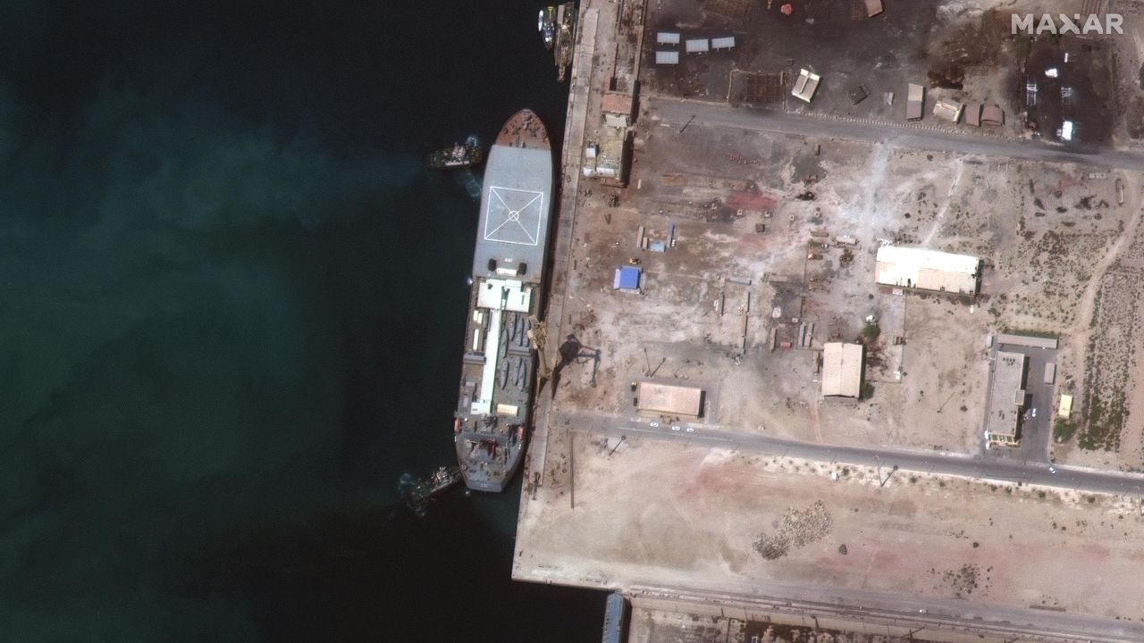 The Iranian ship Makran is seen in this Maxar Technologies satellite image from early May in Persian Gulf around Larak Island. The boat appears to be loaded with seven small fast-attack boats on its deck.