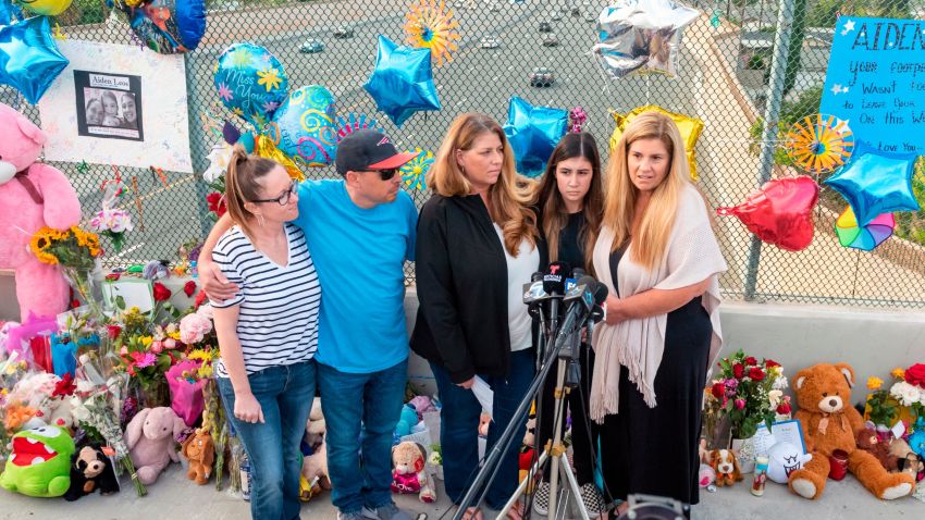 ORANGE, CA - MAY 25: Family members of 6-year-old Aiden Leos stand at a makeshift memorial on the Walnut Avenue overpass at the 55-freeway in Orange on Tuesday, May 25, 2021to announce the reward for tips that lead to the arrest of a suspect have risen to $200,000. After county officials pledged to triple the previous $50,000 reward a local business send a letter to the family pledging an additional $50,000. Family members pictured are, from left, Cherrie Cloonan, John Cloonan, Carole Ybanez, Alexis Cloonan and Carly Lacy.  (Photo by Leonard Ortiz/MediaNews Group/Orange County Register via Getty Images)