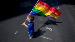 NEW YORK, NY - JUNE 26: A boy carries a flag during the New York City Pride March, June 26, 2016 in New York City. This year was the 46th Pride march in New York City (Photo by Eric Thayer/Getty Images)