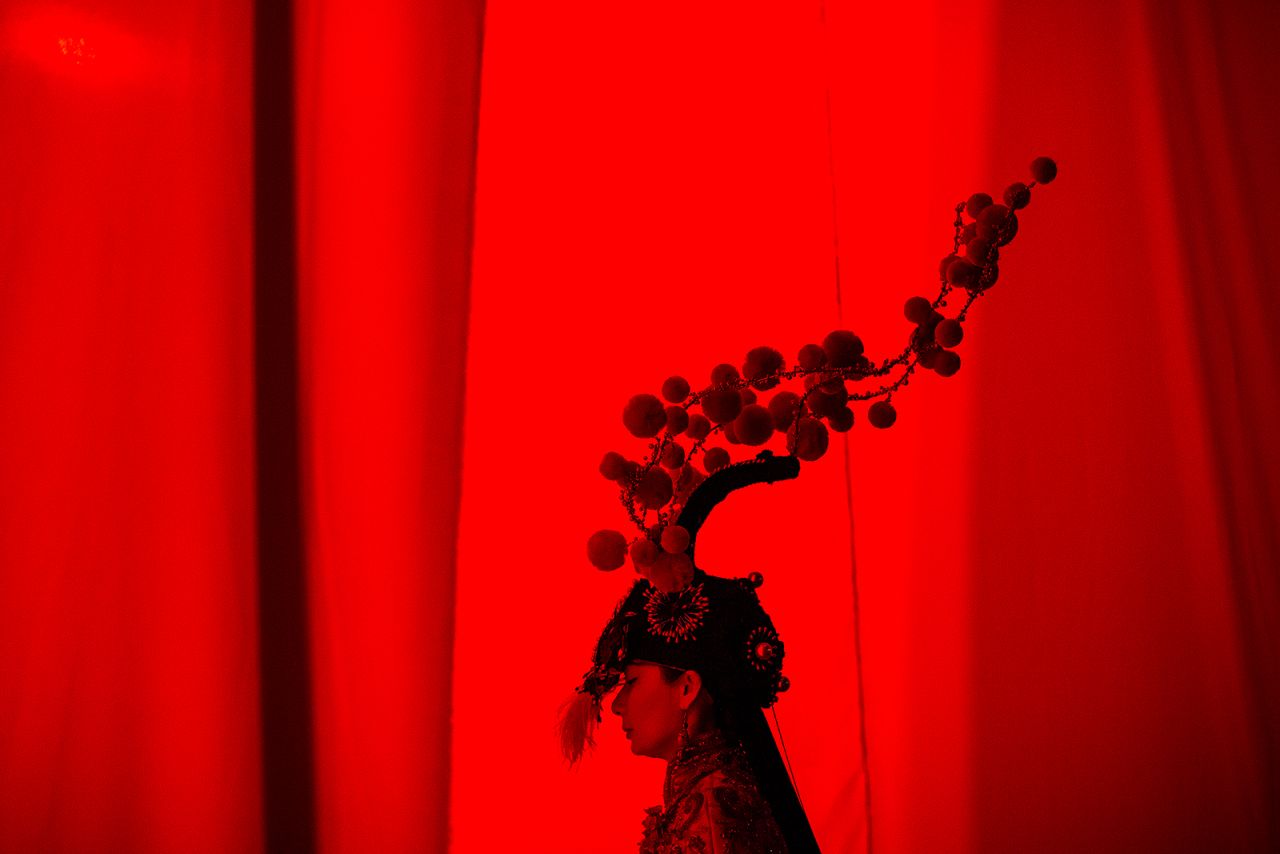 A model is seen backstage at a Sheguang Hu fashion show in Wuhan, China, on Friday, May 28. The show was designed to tell the story of Chinese women through history.