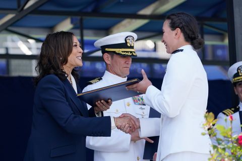A graduate of the US Naval Academy receives her diploma from Vice President Kamala Harris in Annapolis, Maryland, on Friday, May 28.