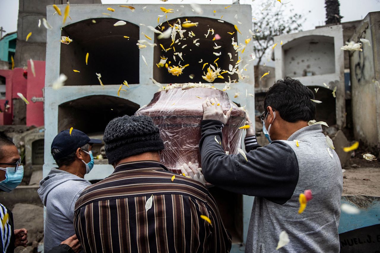 A Covid-19 victim is laid to rest at a graveyard in Comas, Peru, on Tuesday, June 1. <a href="https://www.cnn.com/2021/06/01/americas/peru-covid-death-toll-intl/index.html" target="_blank">Peru has more than doubled its official death toll from the Covid-19 pandemic,</a> following a government review of the figures. It now has the world's highest coronavirus-related death rate per capita.
