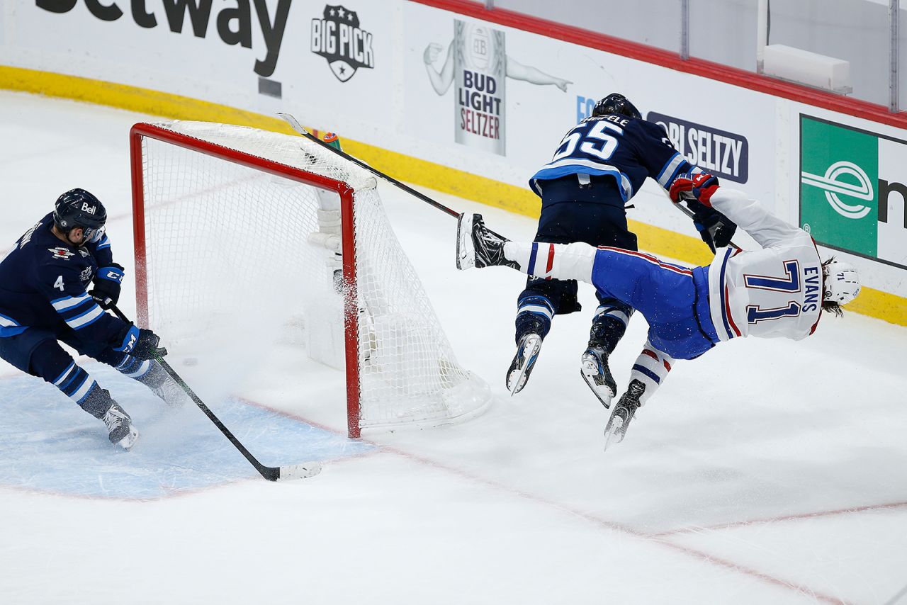 Winnipeg's Mark Scheifele levels Montreal's Jake Evans during an NHL playoff game on Wednesday, June 2. Schiefele received a major penalty for the hit and a game misconduct. He was later suspended for four games. Evans left on a stretcher and suffered a concussion.