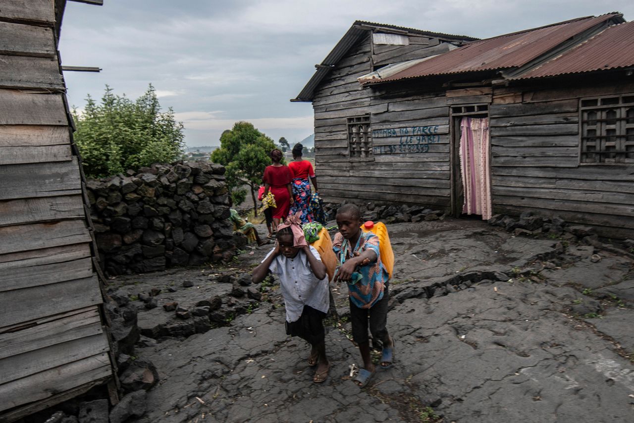 Children look for shelter in Sake, Democratic Republic of Congo, on Thursday, May 27. They fled the city of Goma after <a href="http://www.cnn.com/2021/05/27/africa/gallery/volcano-eruption-democratic-republic-of-congo/index.html" target="_blank">the eruption of Mount Nyiragongo.</a>