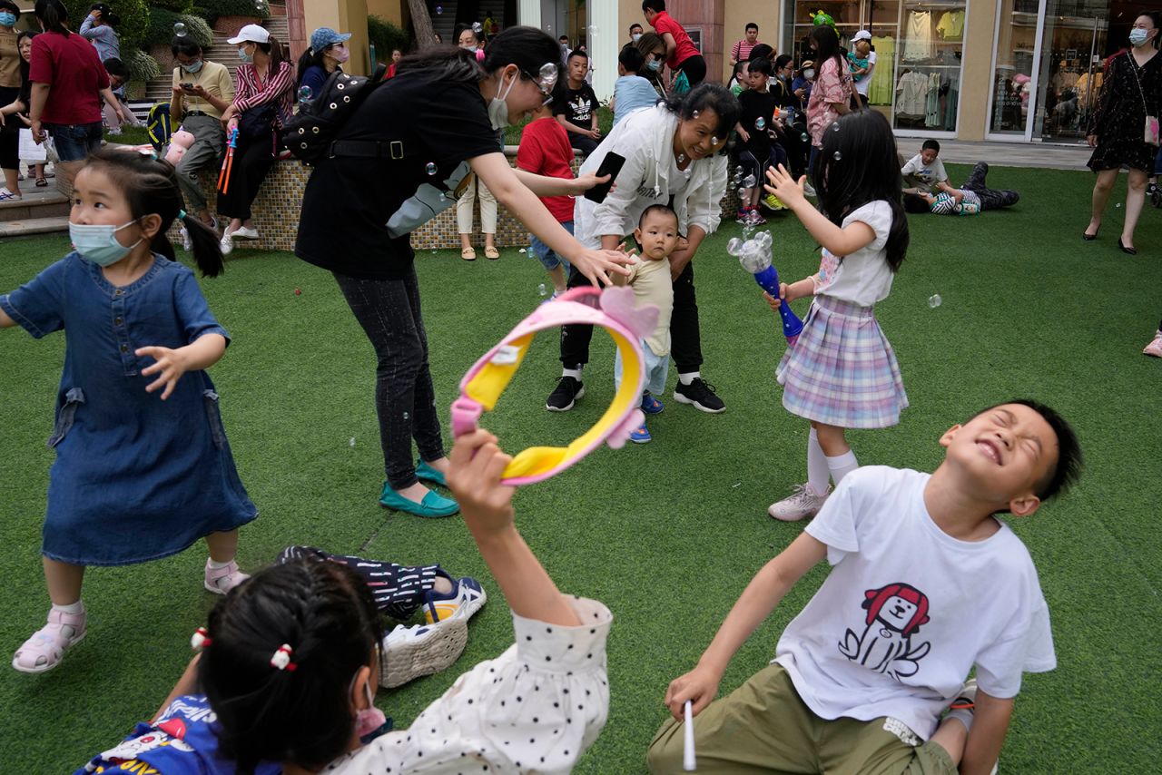 Children play at a mall in Beijing on Tuesday, June 1. In a move designed to combat the country's aging population, the Chinese government <a href="https://www.cnn.com/2021/05/31/china/china-three-child-policy-intl-hnk/index.html" target="_blank">will allow couples to have three children,</a> according to <a href="http://www.xinhuanet.com/politics/2021-05/31/c_1127513067.htm" target="_blank" target="_blank">state-run news agency Xinhua.</a> China's one-child policy was introduced in 1979 to address overpopulation and alleviate poverty. That was loosened to two children per family in 2015.