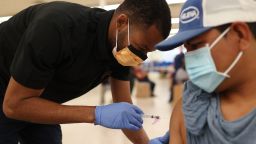 Odilest Guerrier, Medical Assistant, administers a Moderna COVID-19 vaccine to Pasqual Cruz at a clinic set up by Healthcare Network on May 20, 2021 in Immokalee, Florida.