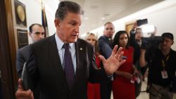 Sen Joe Manchin (D-WV) talks to reporters about his support for a January 6 commission while walking down the hall of the Dirksen Senate Office Building on May 27, 2021 in Washington, DC.